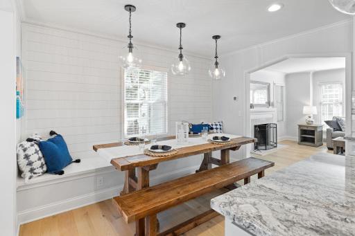 Large dining area with built-in banquette and shiplap