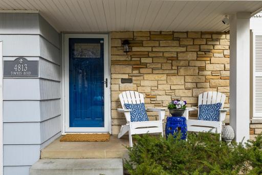 Inviting Front Porch with decorative rock façade.
