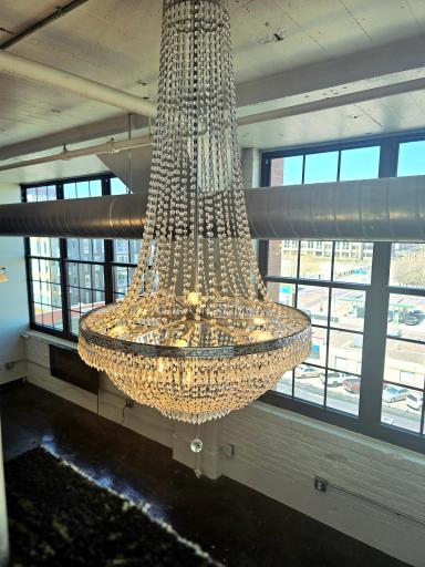 2 beautiful large crystal chandeliers hang from the high ceiling.