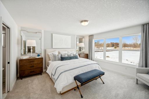 (Photo of model home, actual features may vary) The owner’s suite is a lavish haven on the top floor, hosting a large bedroom that will create your own serene retreat