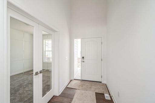 Step inside to find sleek French doors to guide you into the flex room, just offside the entry