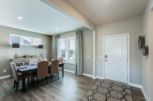 A flex room off the spacious entry from the front door offers room for dining, a home office, or another seating area to visit with guests.