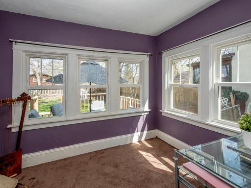 Sunroom off dining room makes a great office or playroom