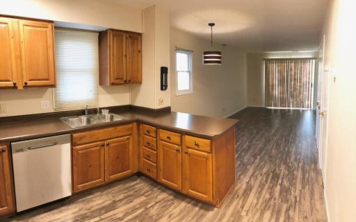 Updates include flooring, paint and kitchen. Kitchen features solid cabinets, and stainless steel appliances.