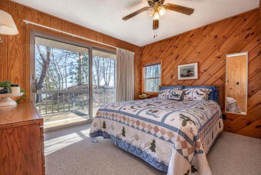 Knotty pine walls in the lakeside bedroom
