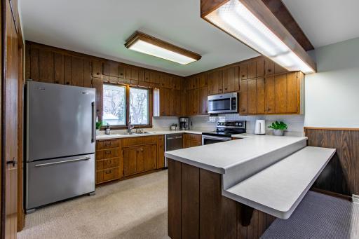 Sunny kitchen featuring stainless steel appliances
