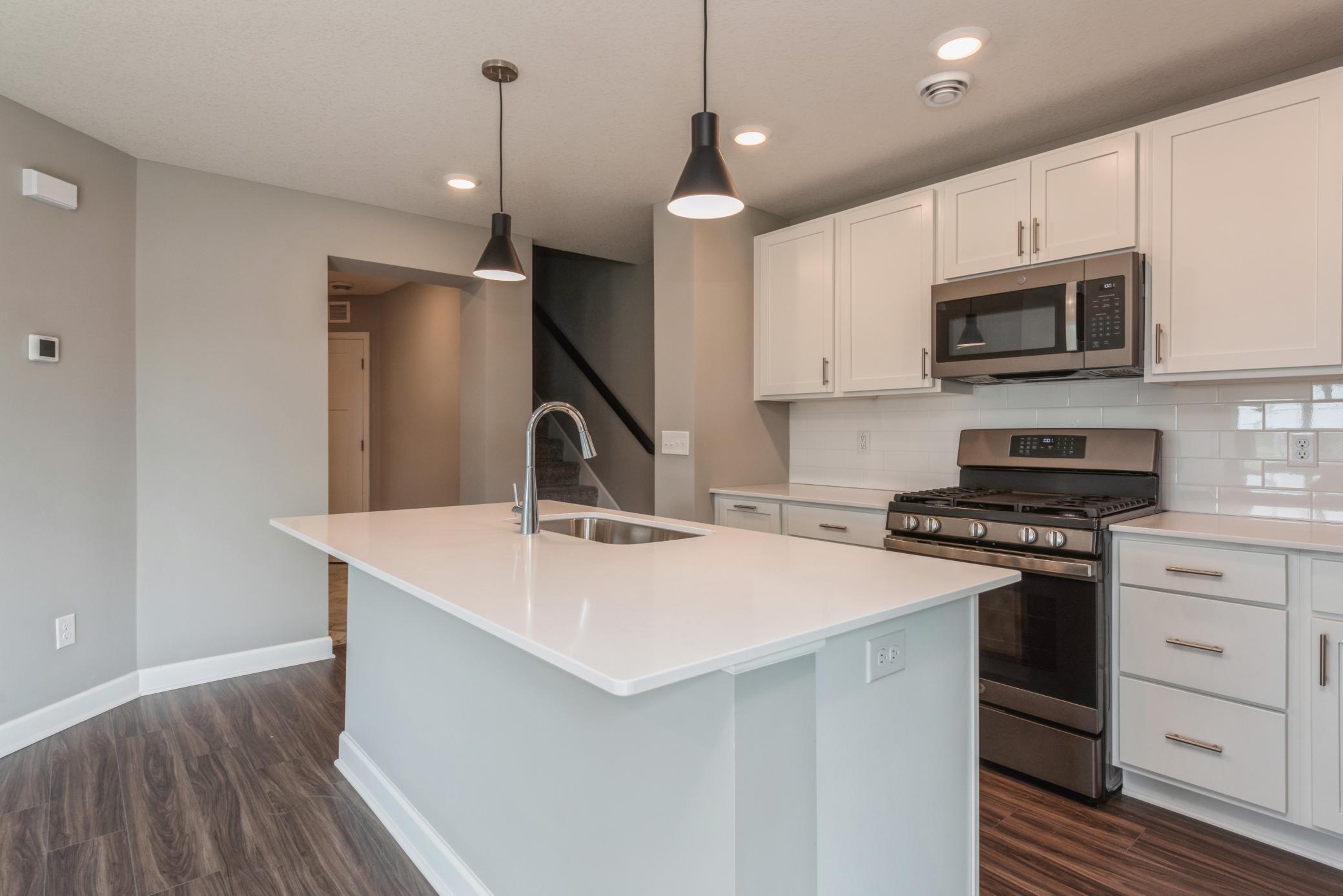Welcome to Weston Commons! This stunning Franklin end unit is available for a May completion! *Photos are of another home, colors and finishes will vary.