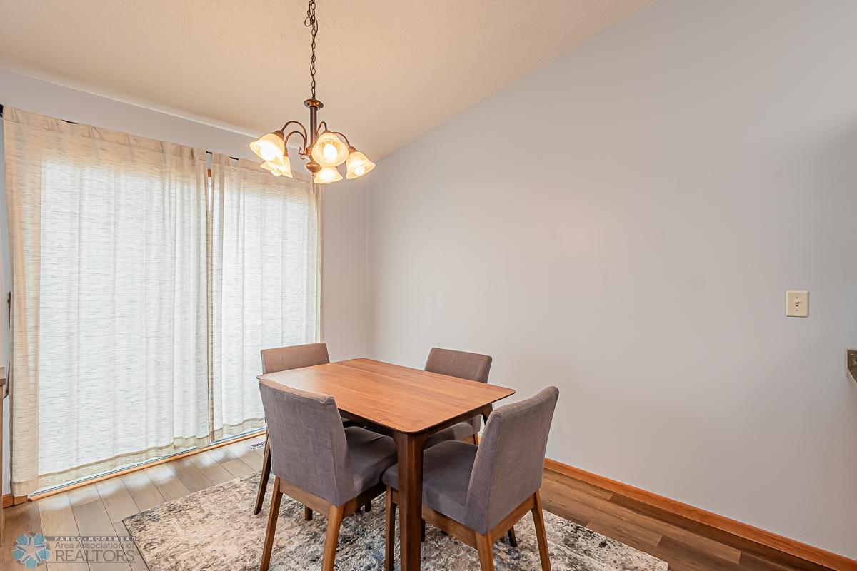 Access to large deck & fenced backyard from patio door in dining room
