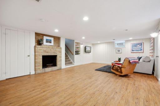 Lower-level family room with wood-burning fireplace