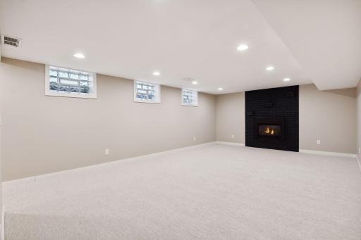 Spacious lower level family room with Gas Fireplace