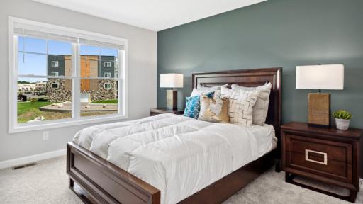 (Photo of a decorated model, actual homes finishes will vary) This primary bedroom is the perfect hideaway after a busy day.