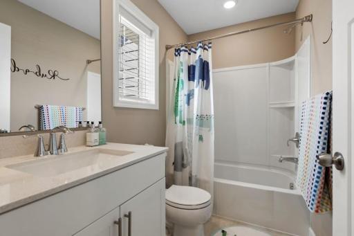 (Photo of a decorated model, actual homes finishes will vary) This secondary bath is sure to keep everyone moving during those busy mornings!