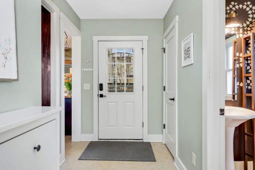 The mudroom provides a practical transition space from the outdoors with its functional layout and easy access.