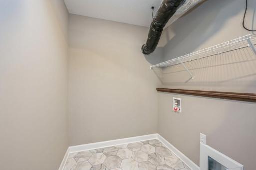 (Photo of a similar home, actual homes finishes will vary) Centrally located on the upper level, along with the three bedrooms, this laundry room is sure to provide the ultimate convenience!