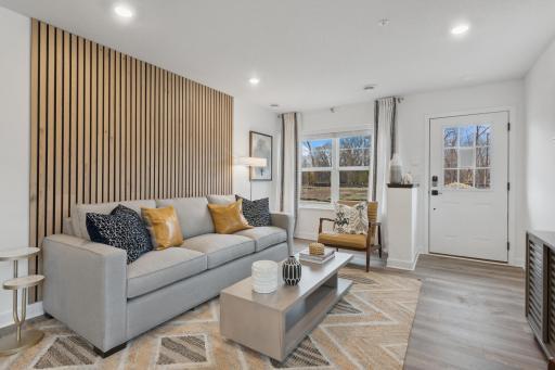 (Photo of model, actual features may vary) Step inside to see the open concept living area that connects seamlessly to the dining and kitchen