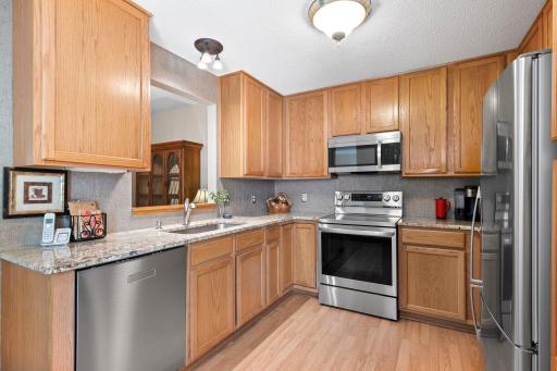 Sparkling granite countertops, and newer stainless steel appliances.