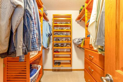 Organize in style with this expansive walk-in closet, featuring customized shelving and ample hanging space. Perfect for fashion enthusiasts, this closet makes arranging and accessing apparel effortless.