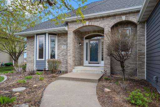 This walkout rambler is truly a work of art! It is loaded with specialty windows, bays, vaulted ceilings, quality floorings, and custom floor plan designs throughout!