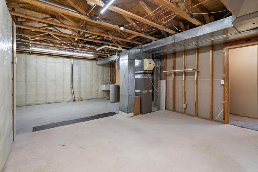 There is a huge unfinished double room perfect for a workshop or hobbies, or maybe exercise equipment or an in-home business? Note the laundry tub and hookups for an optional second laundry!