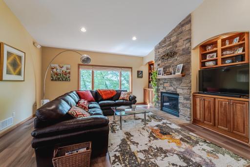 Family room with Lake views and a Floor to ceiling Stone Fireplace