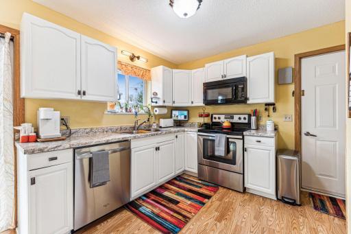 Bright open kitchen with stainless steel appliances