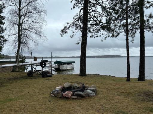 A closer look at the firepit with the lake beyond.
