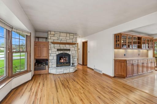 Wow! A beautiful, rare wood burning fireplace with a classy oak mantel! A gas line is already installed if a conversion is desired. Another feature is the blower that streams warmed air from around the back of the heat box to the home's main level