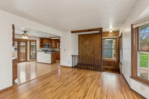 View from the fireplace to the dining room and kitchen. The living room and all 3 bedrooms have pristine, newly refinished hardwood floors - all professionally done.