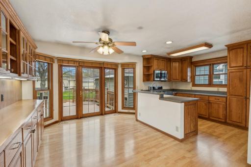 Look at that floor to ceiling bay with all the windows! And a French door leading to the deck. There's no shortage of natural light and views to the lovely surroundings outside.