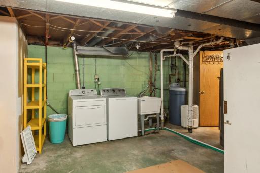 Laundry room. Note the homes upgraded plumbing in the home (about a $5,000 investment).