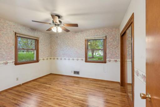 All three main floor bedrooms feature newly refinished hardwood flooring, updated windows and ceiling fans!
