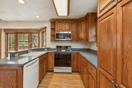 Gorgeous, timeless custom crafted oak cabinetry providing plenty of room for all your storage needs (including a large corner turntable and pantry with pullouts).