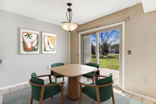 Informal dining area just off the kitchen with patio access to Fairway Condo's beautifully landscaped common area.