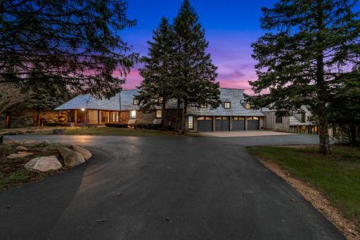 The property features a 4-car garage with additional garage parking in the Morton building.