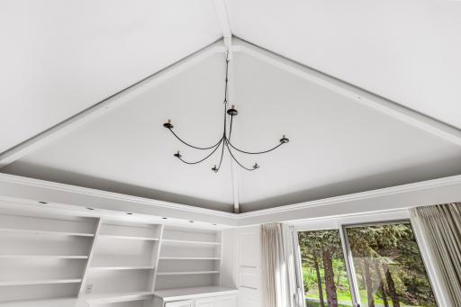 The front room is filled with natural light and can be used as additional living space or an office.