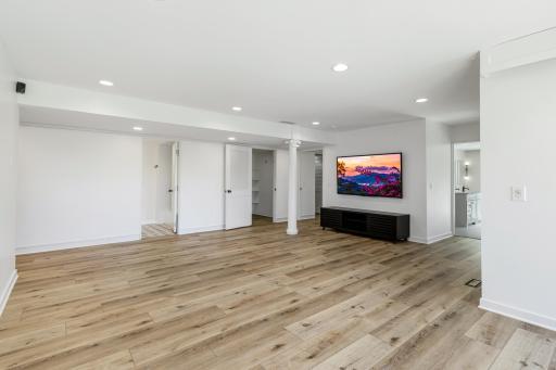 The lower level offers a large family room space and 3 additional bedrooms.