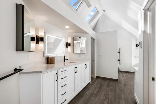 The large primary bathroom is completely updated with heated floors, a heated towel rack, an eco-friendly combination bidets/toilet with heated seat, a spacious, walk-in shower and luxurious soaking tub.