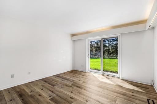 the third of 3 lower level bedrooms, all offering beautiful views and natural light.