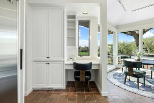 The kitchen offers a small working space with views of the property.