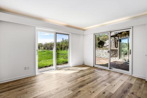 the third of 3 lower level bedrooms, all offering beautiful views and natural light.