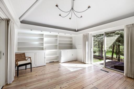 The front room is filled with natural light and can be used as additional living space or an office.