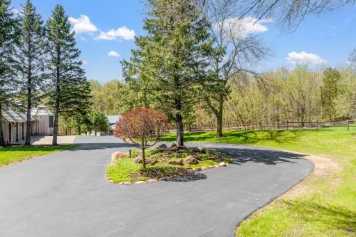 The paved area in front of the home and Morton building offers plenty of parking for guests.