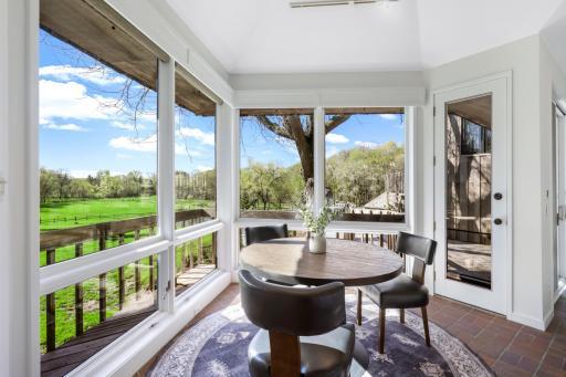 The kitchen is bright and open to the informal dining space and family room space.