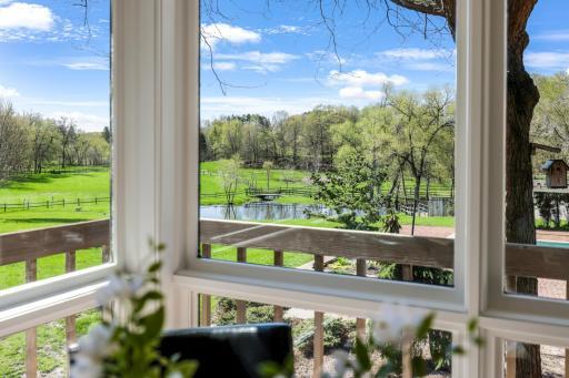 The casual dining space offers panoramic views of the stunning property.