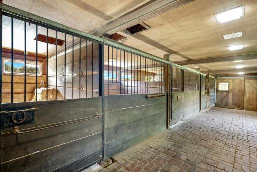 The four stall horse stable with above hayloft.