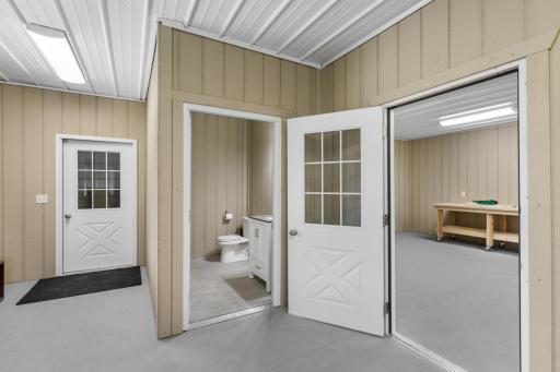 The nearly 3,000 square foot Morton building features a 32x30 foot heated workshop with boiler and in-floor heating, a water heater, half bathroom and 42x48 cold storage space with 3 overhead garage doors.