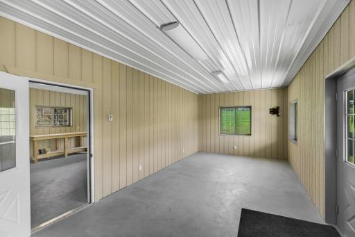 The nearly 3,000 square foot Morton building features a 32x30 foot heated workshop with boiler and in-floor heating, a water heater, half bathroom and 42x48 cold storage space with 3 overhead garage doors.