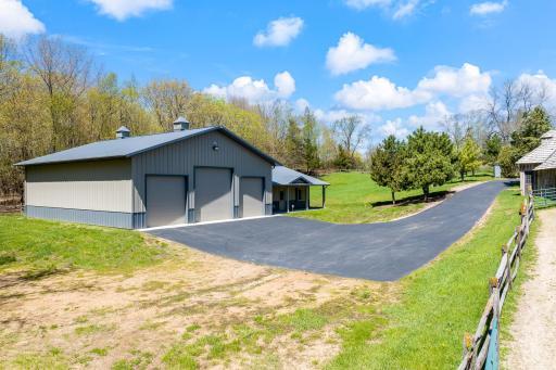 The nearly 3,000 square foot Morton building features a 32x30 foot heated workshop with boiler and in-floor heating, a water heater, half bathroom and 42x48 cold storage space with 3 overhead garage doors.