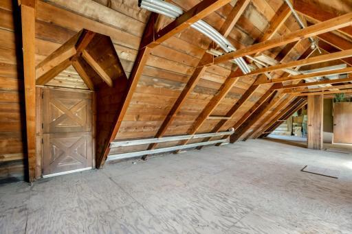 The four stall horse stable with above hayloft.