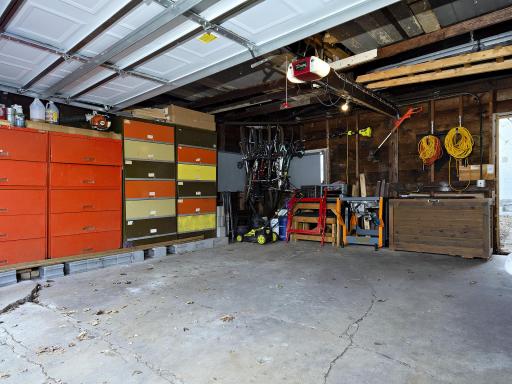 2 car detached garage with shelving that will stay and garage door opener. Loft for additional storage space.